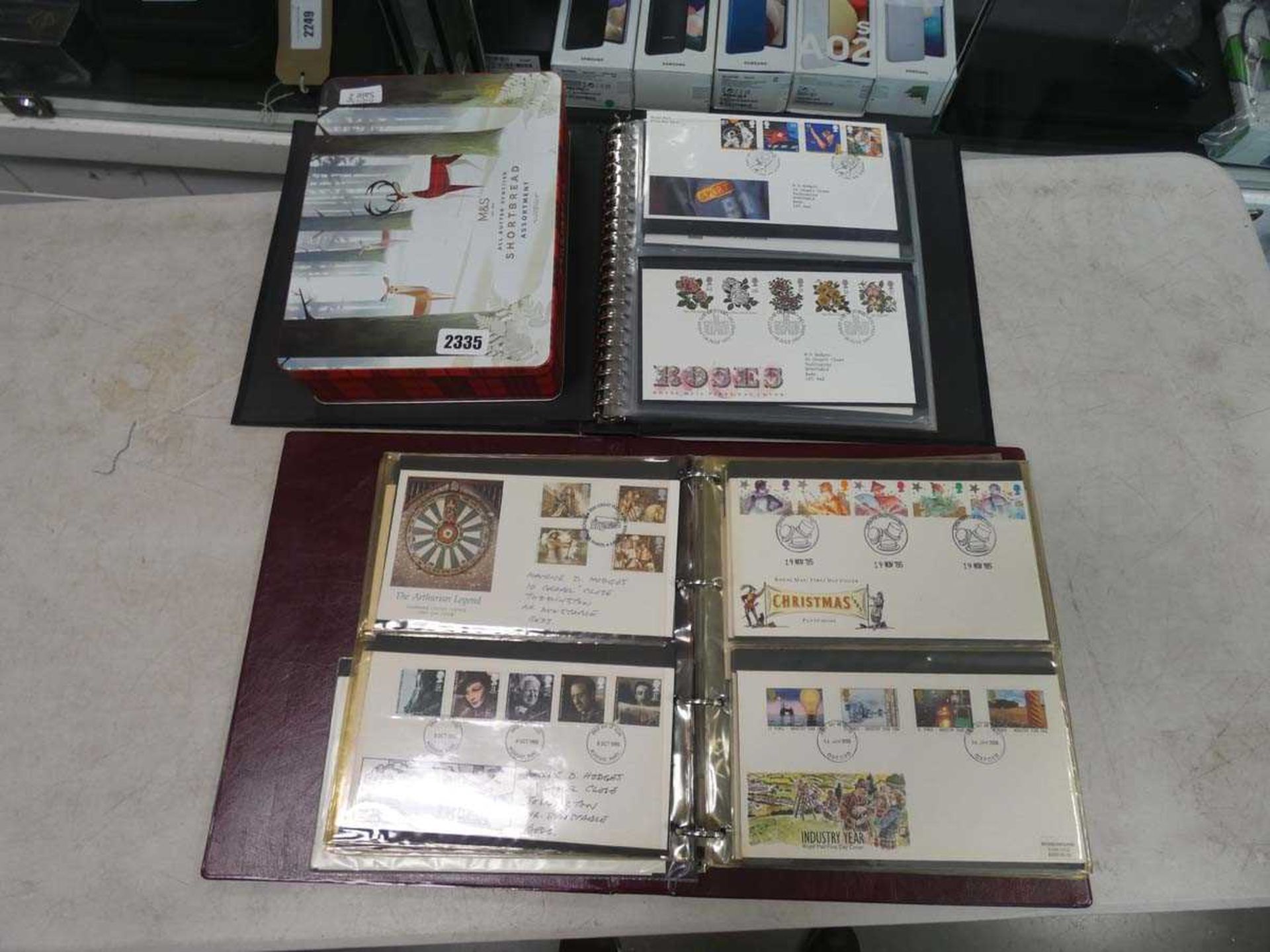 Selection of first day covers to include 2 binders and some loose in tin
