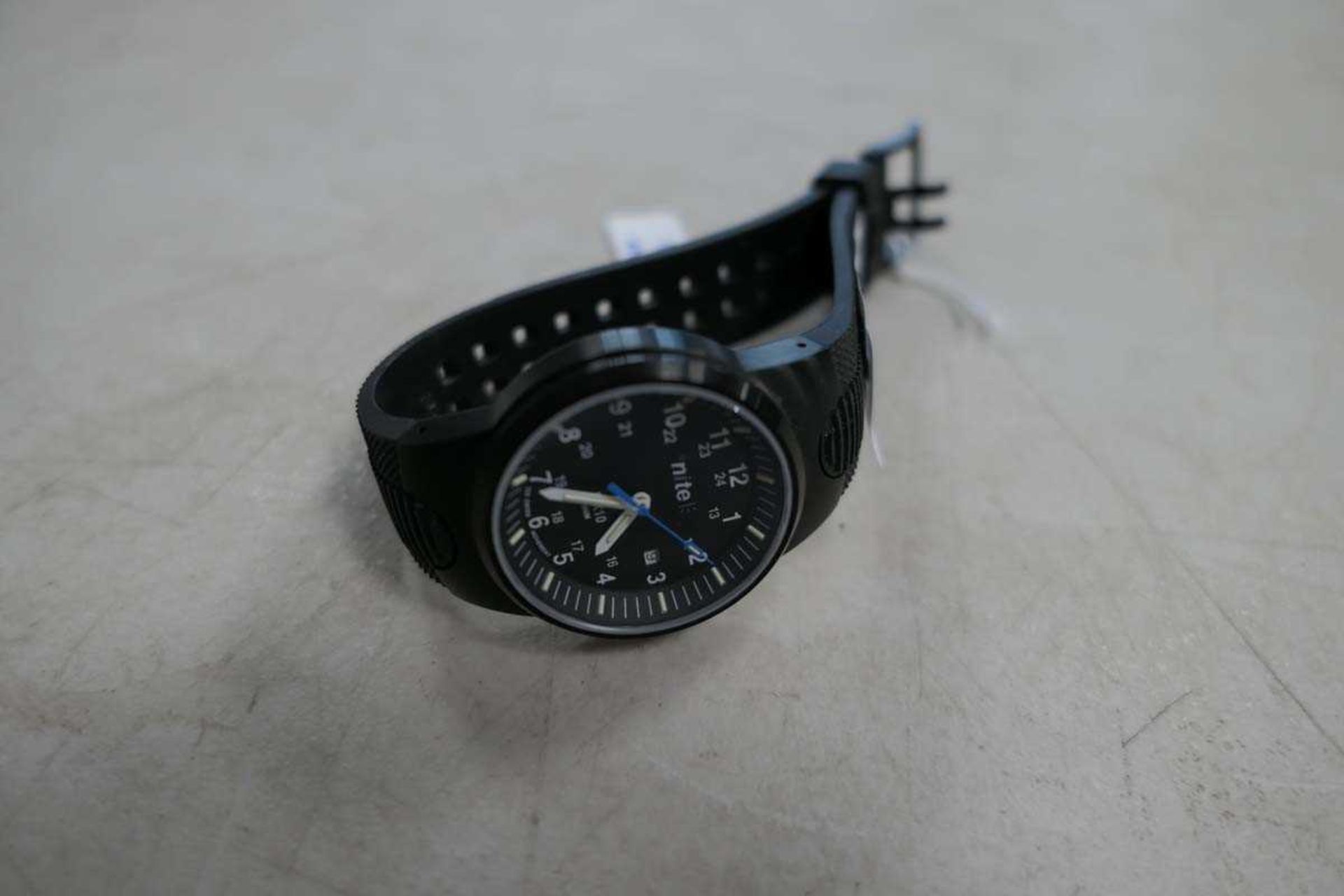 Gents black Nite quartz rubber strap watch with date and black Arabic dial