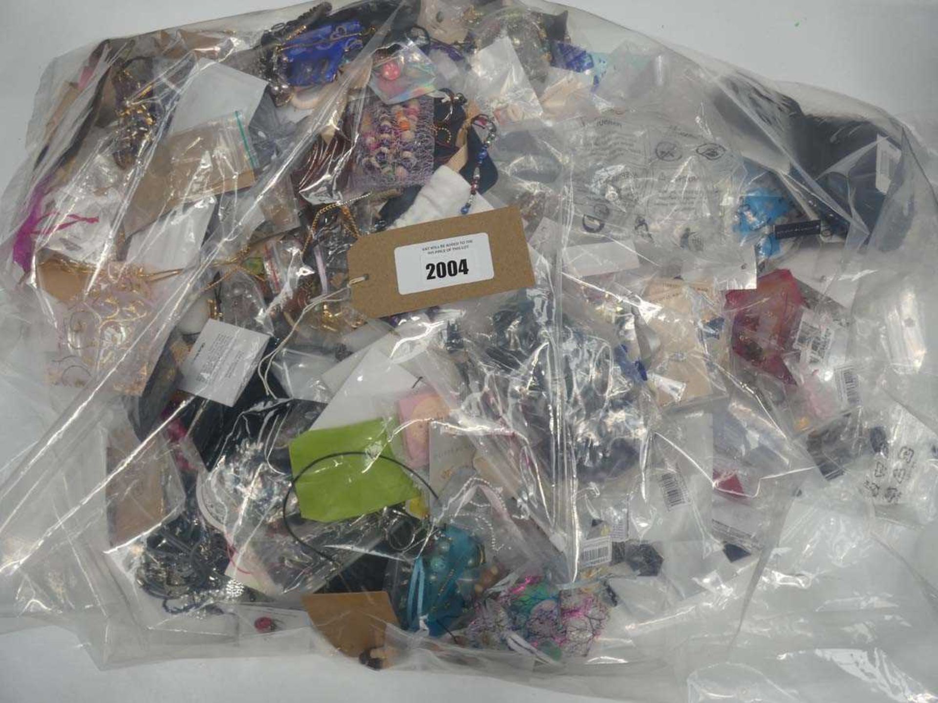 +VAT Bag containing quantity of loose costume and dress jewellery