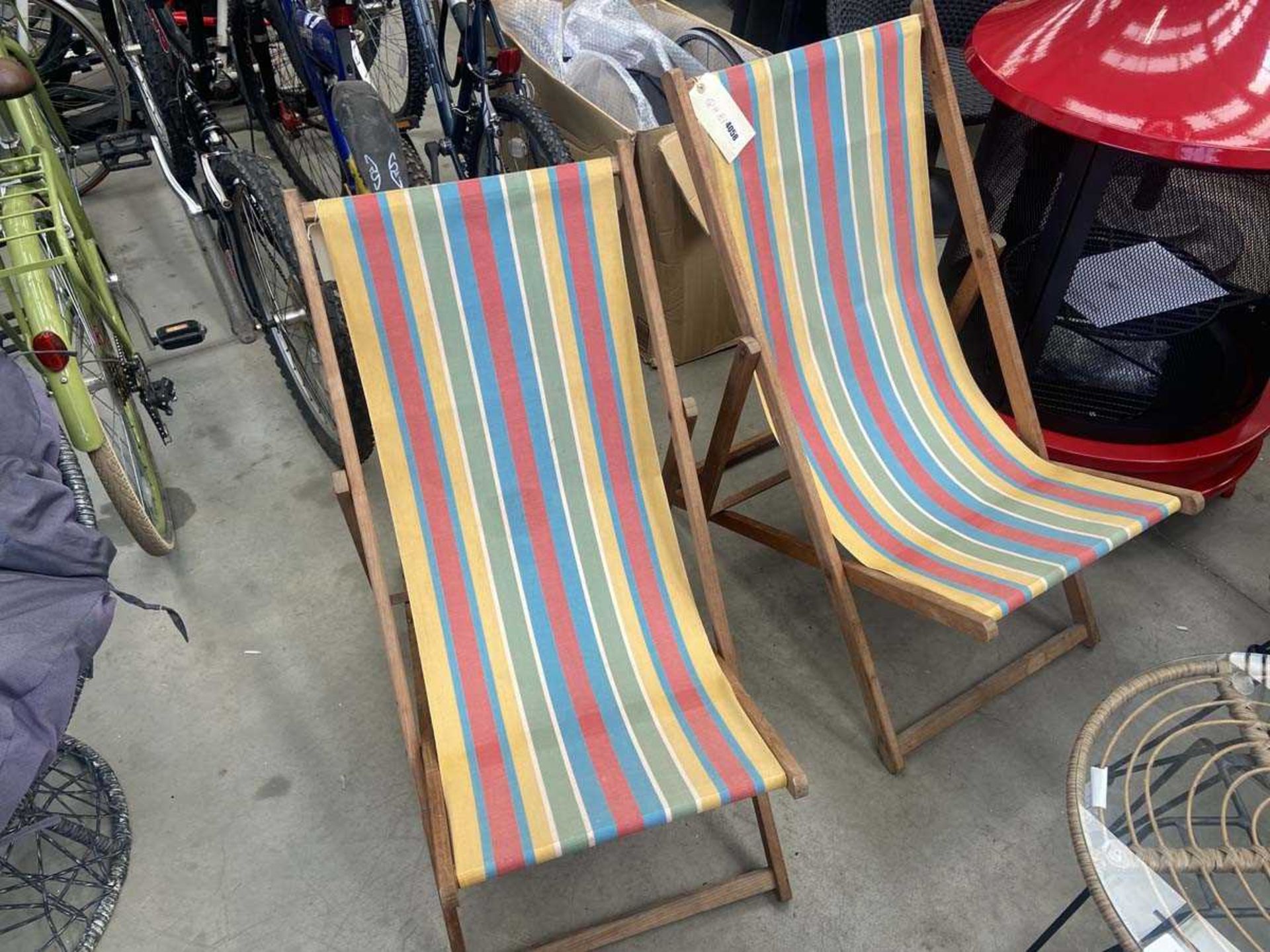 Pair of striped fabric folding deck chairs