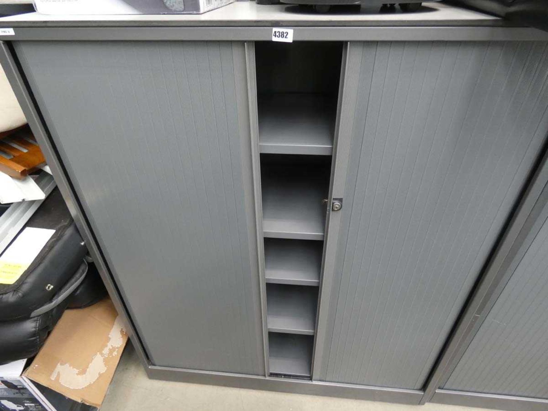 Grey tambour door stationery cupboard