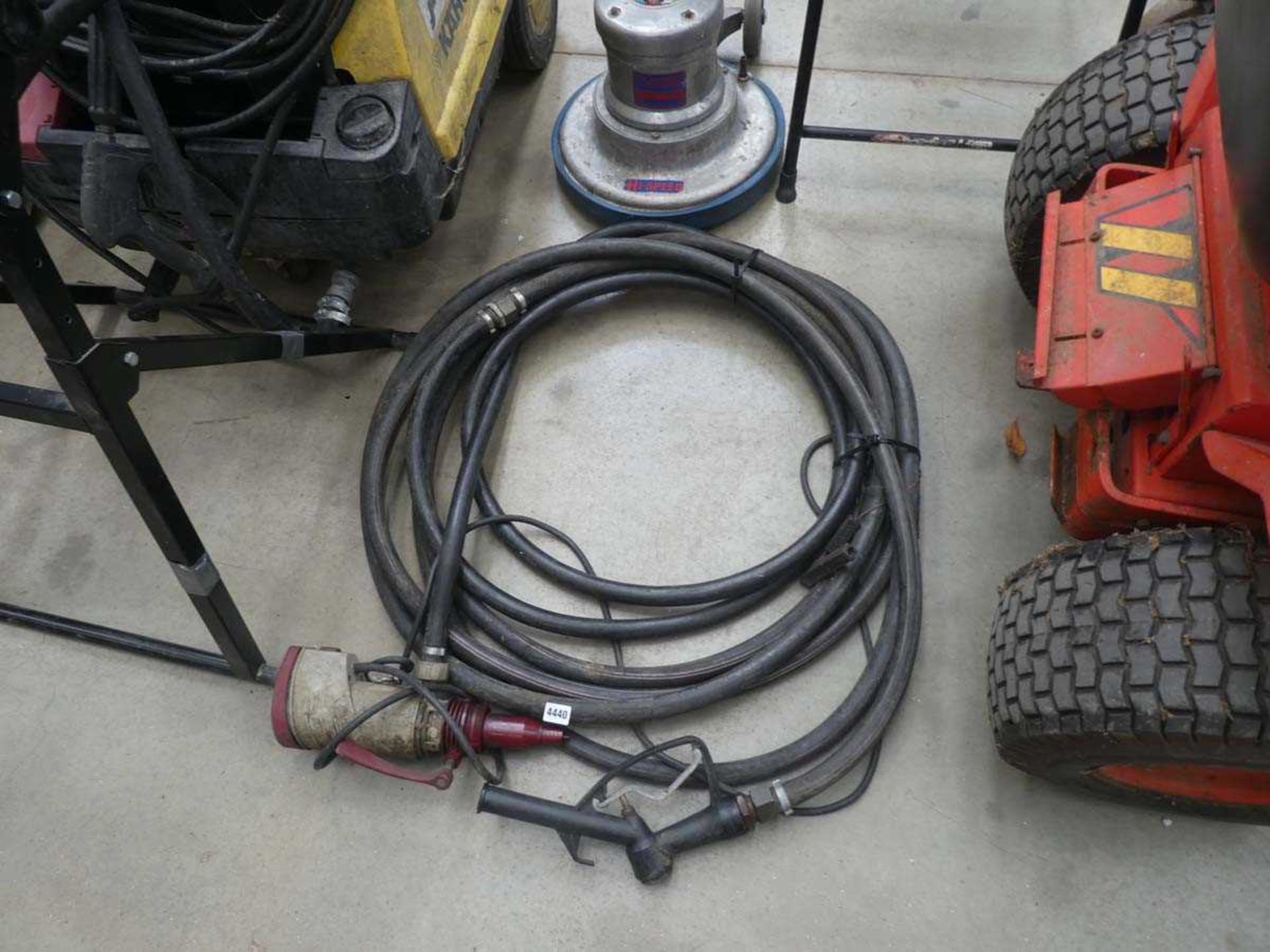 Roll of black air hose with spray attachment