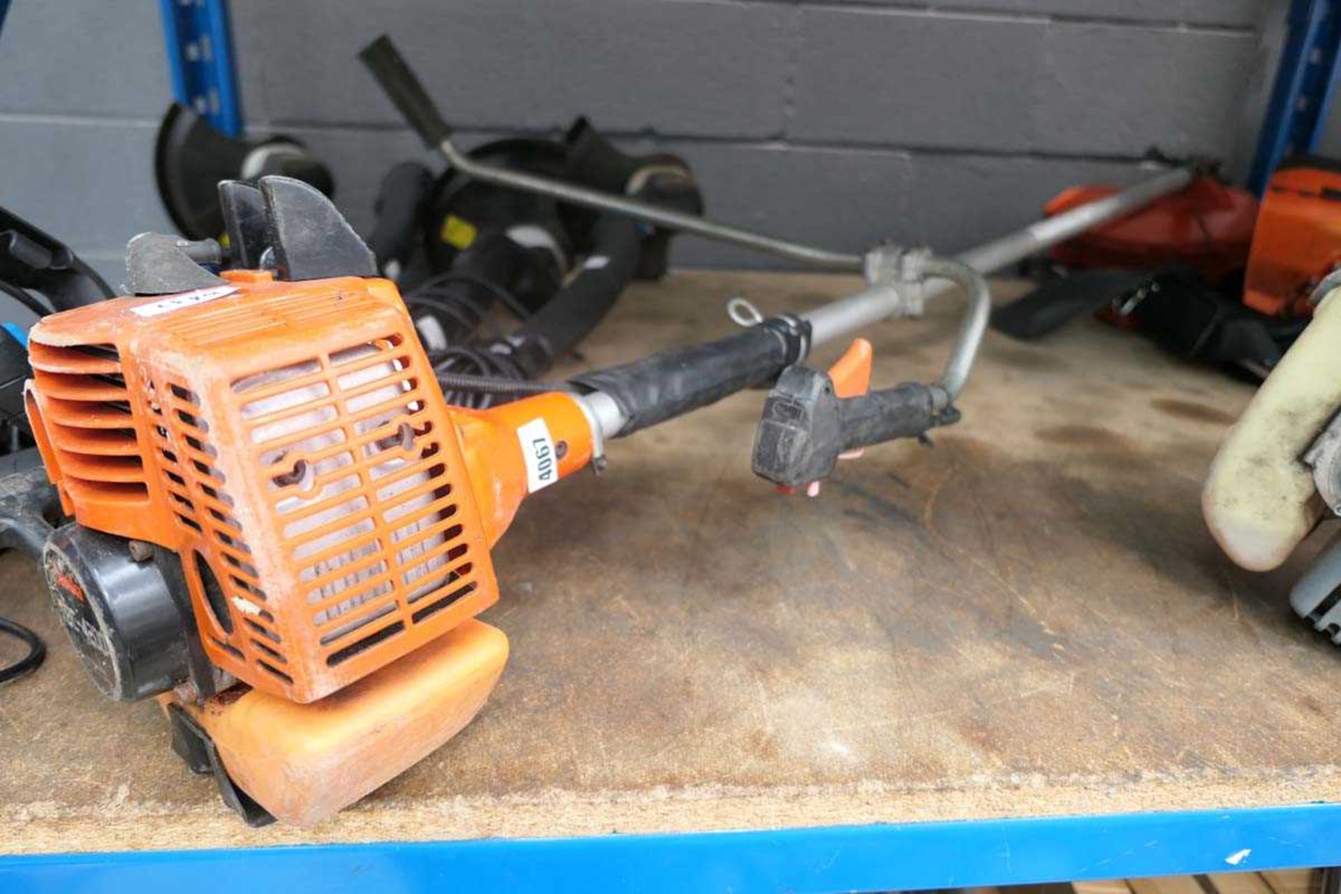 Orange Tanaka petrol powered strimmer