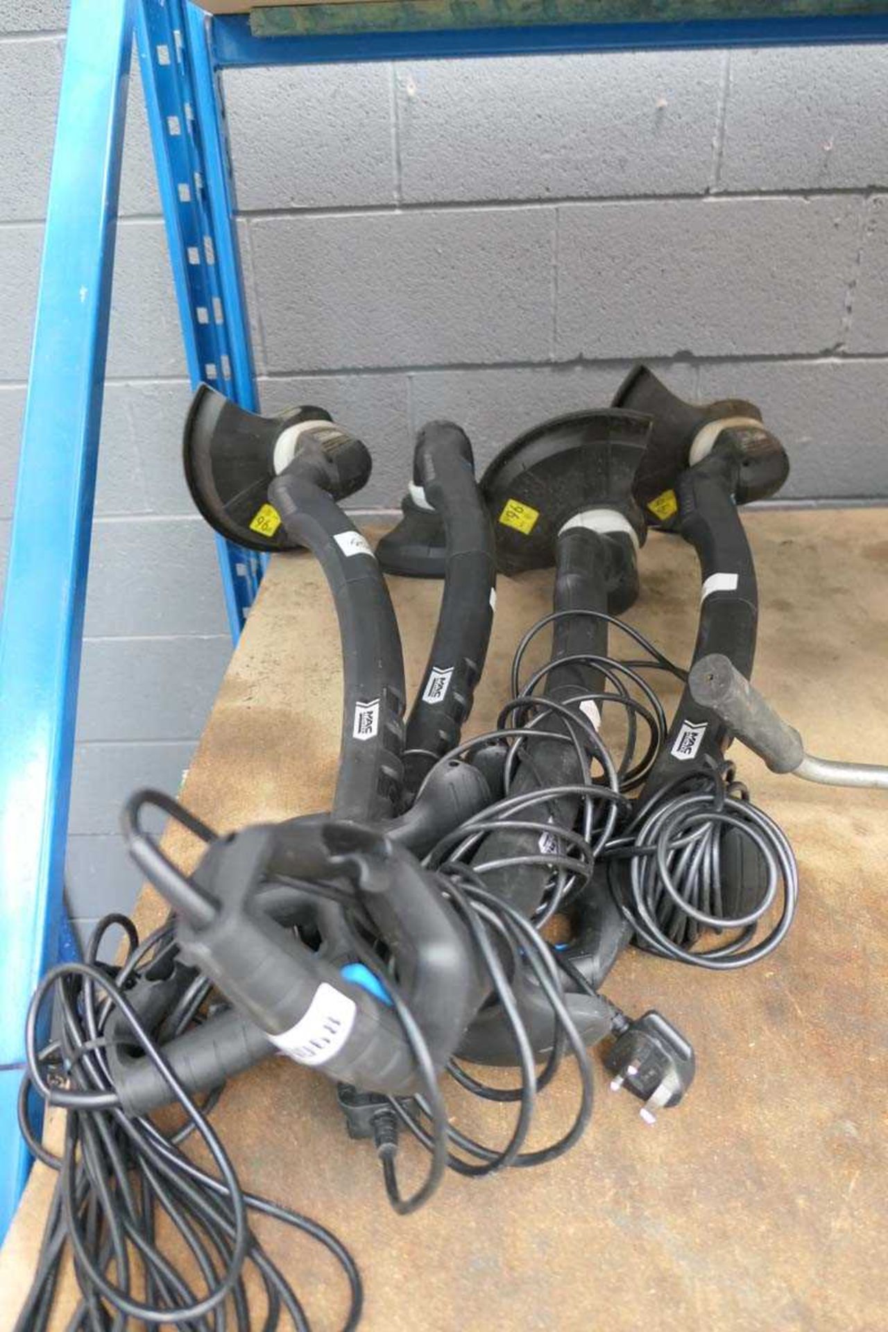 Four Mccallister electric strimmers