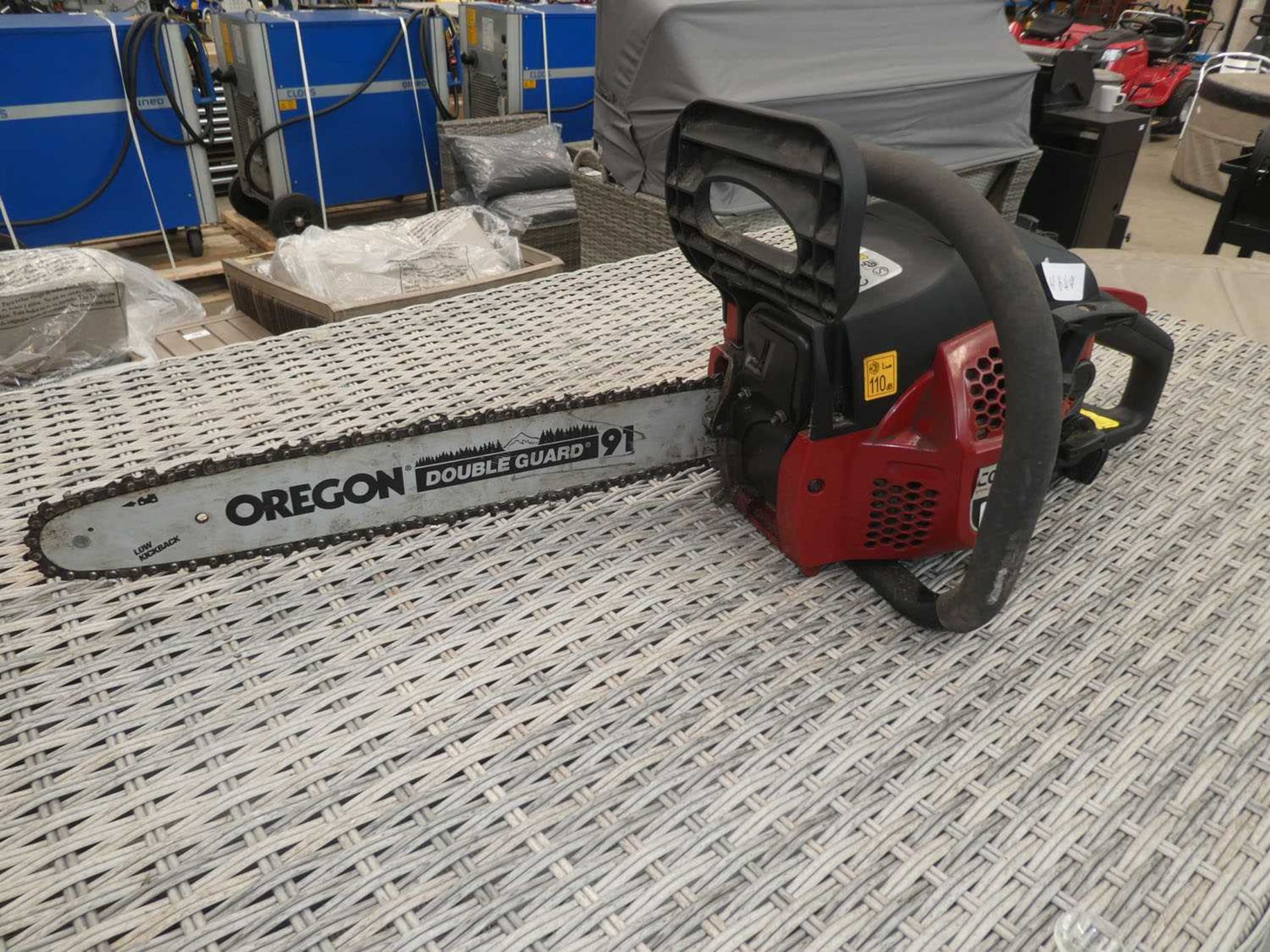 Cobra red petrol powered chainsaw