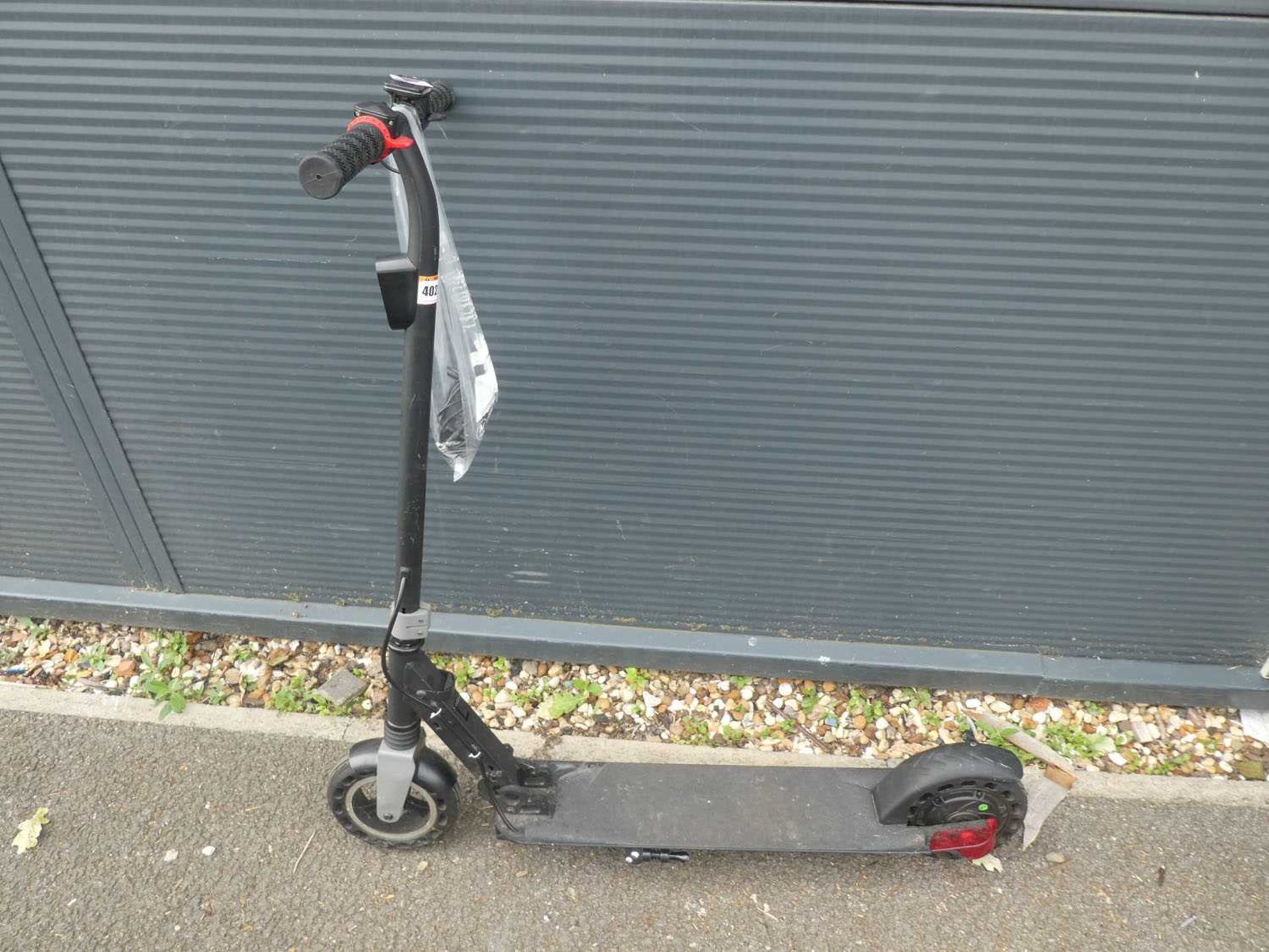 Electric scooter with bagged charger