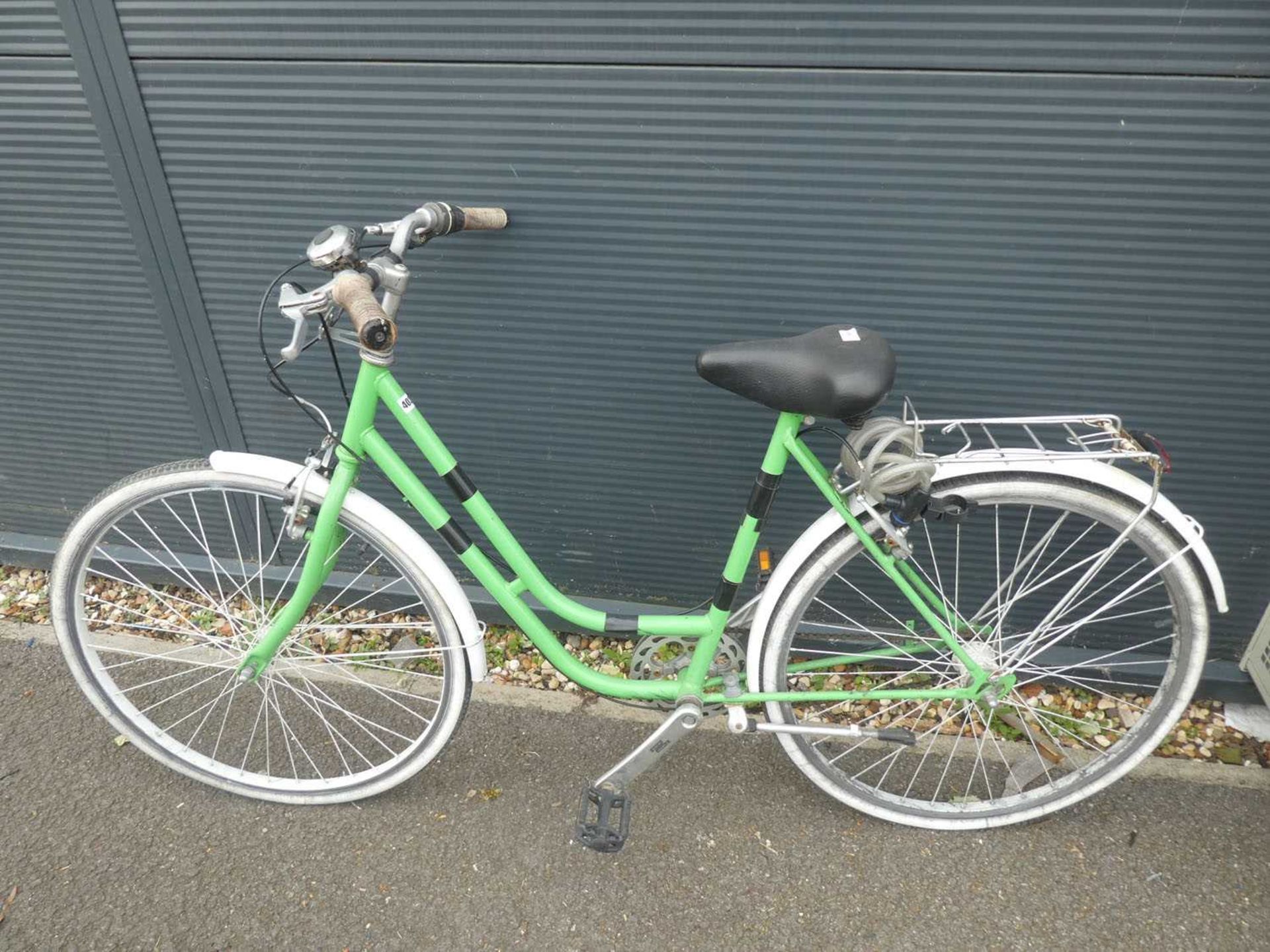 Green and white ladies bike