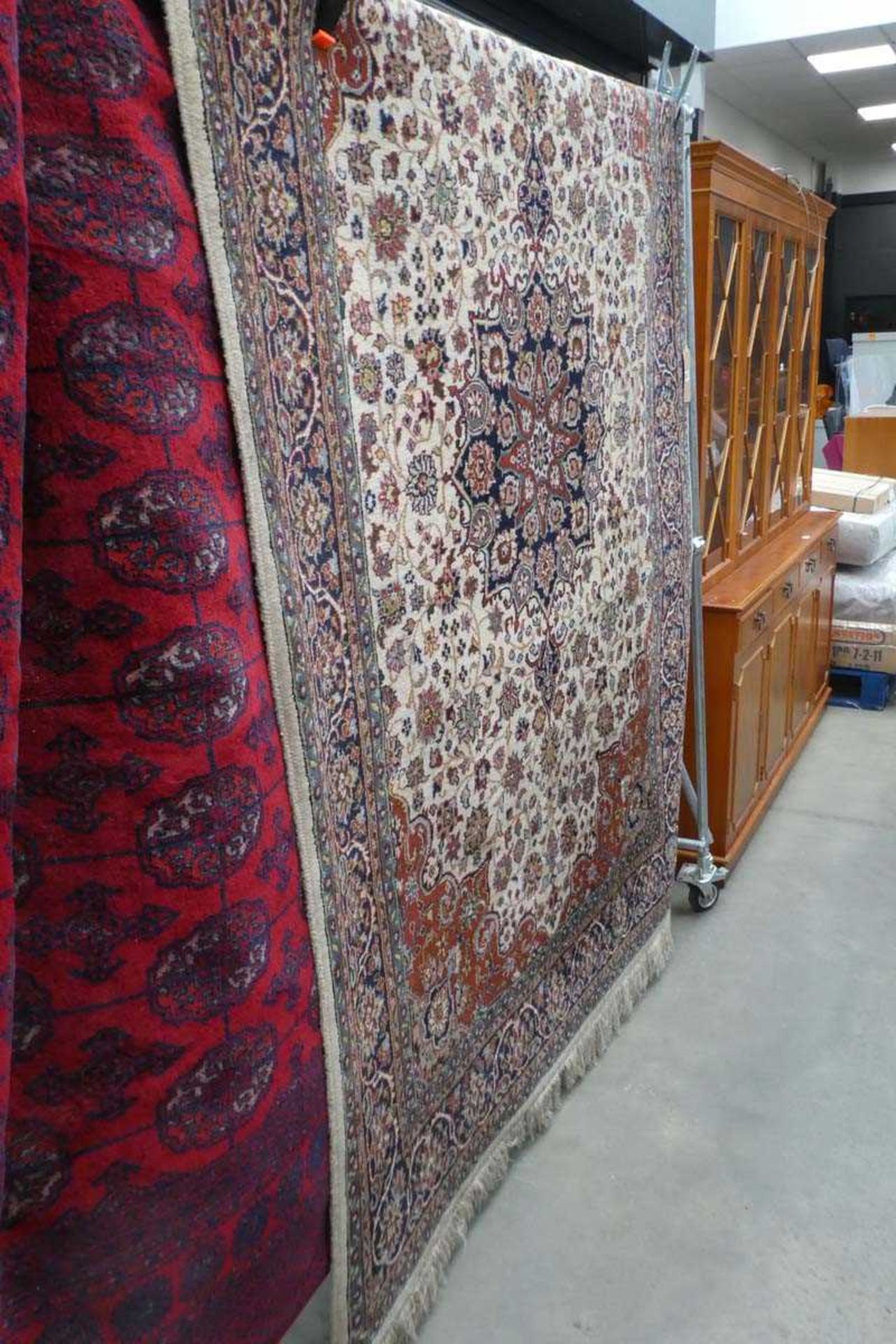 (2) All wool handmade carpet with floral and geometric design in blue and greens