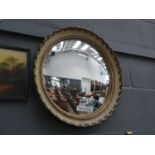 Convex mirror in cream and gilt frame