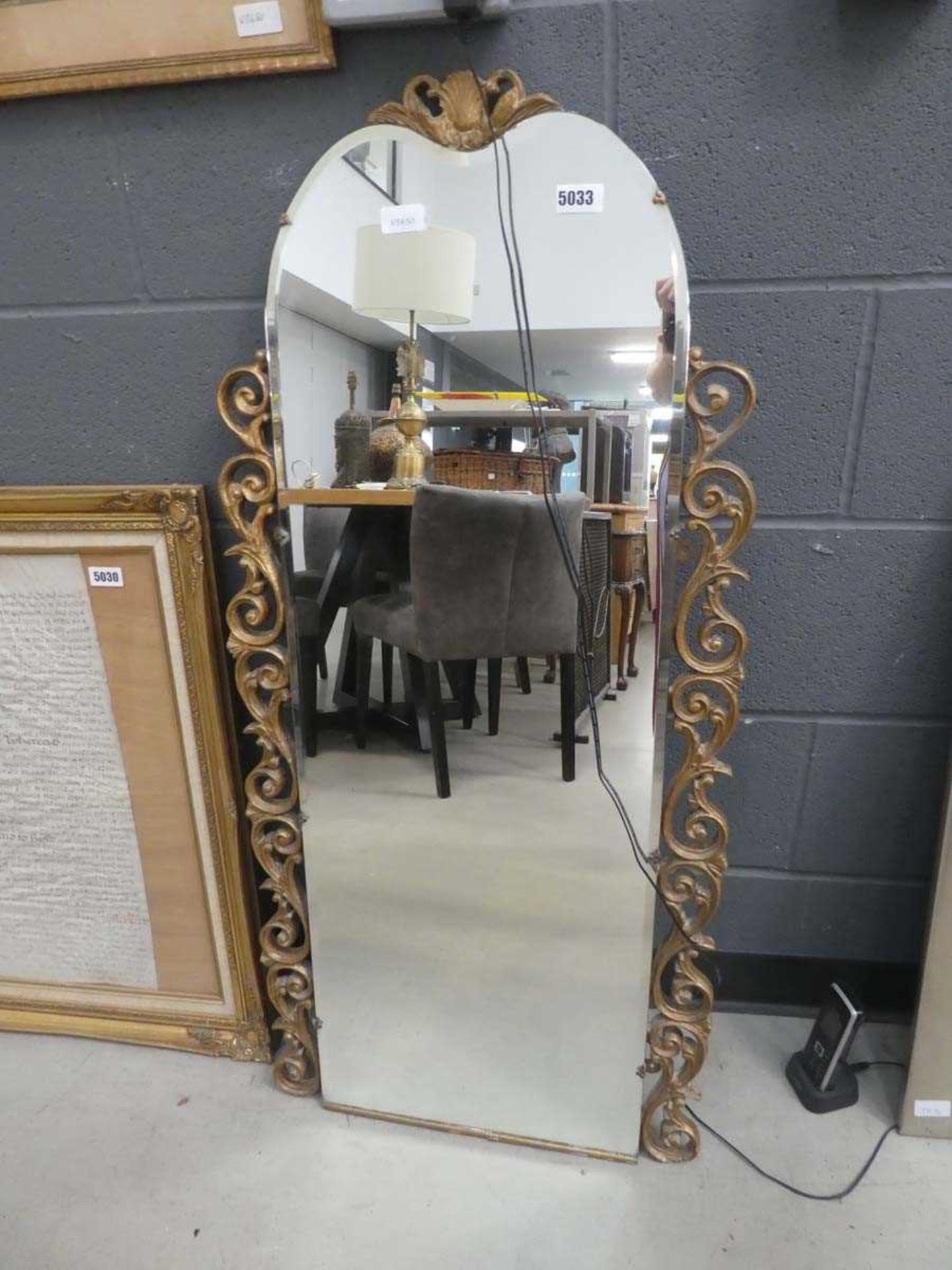 Dome topped bevelled mirror with ornate gilt frame