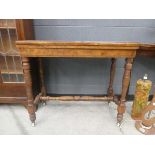 Late 19th/early 20th century fold-over walnut card table with cross stretcher