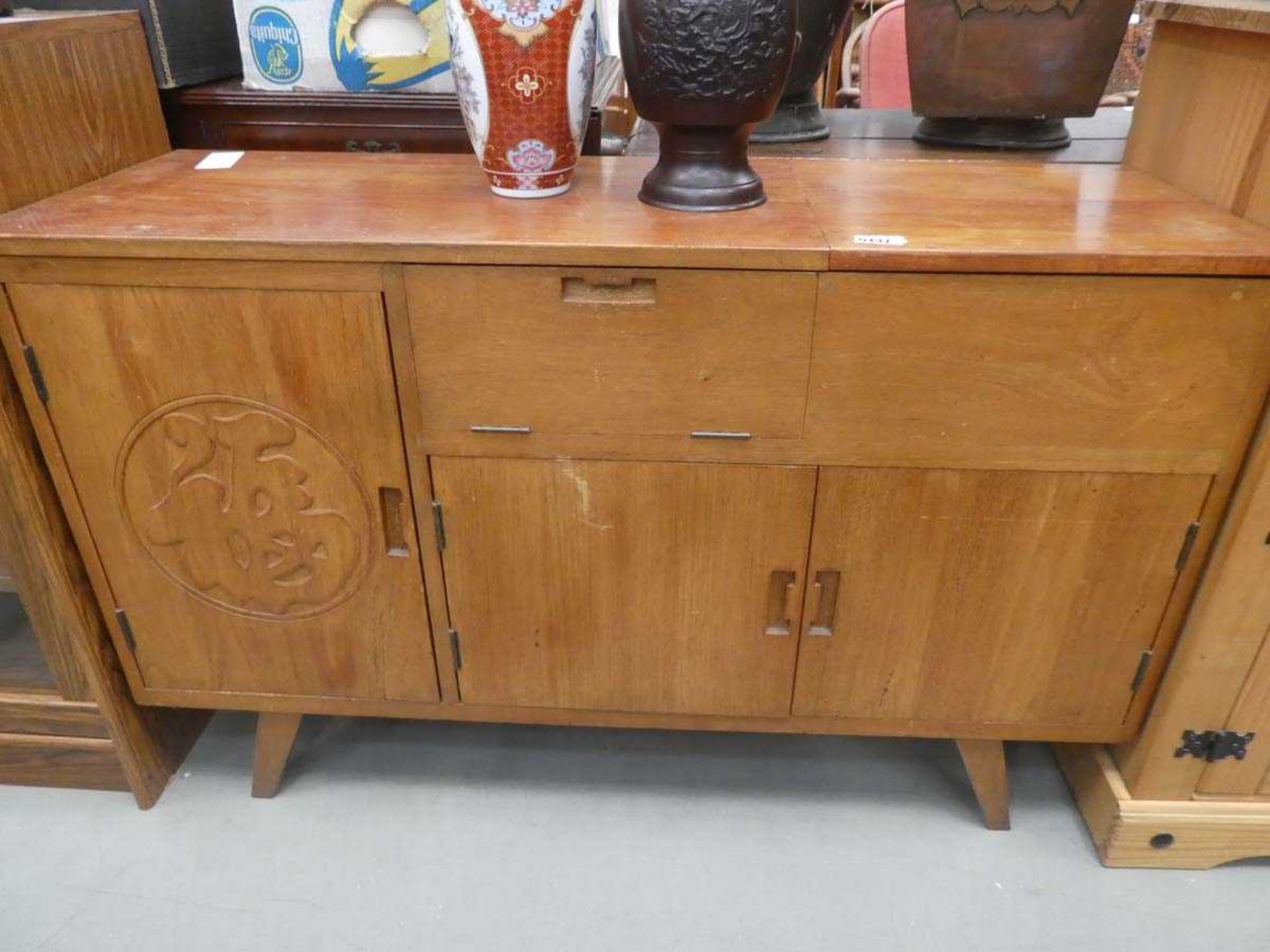 Carved teak sideboard with full front and cupboards under