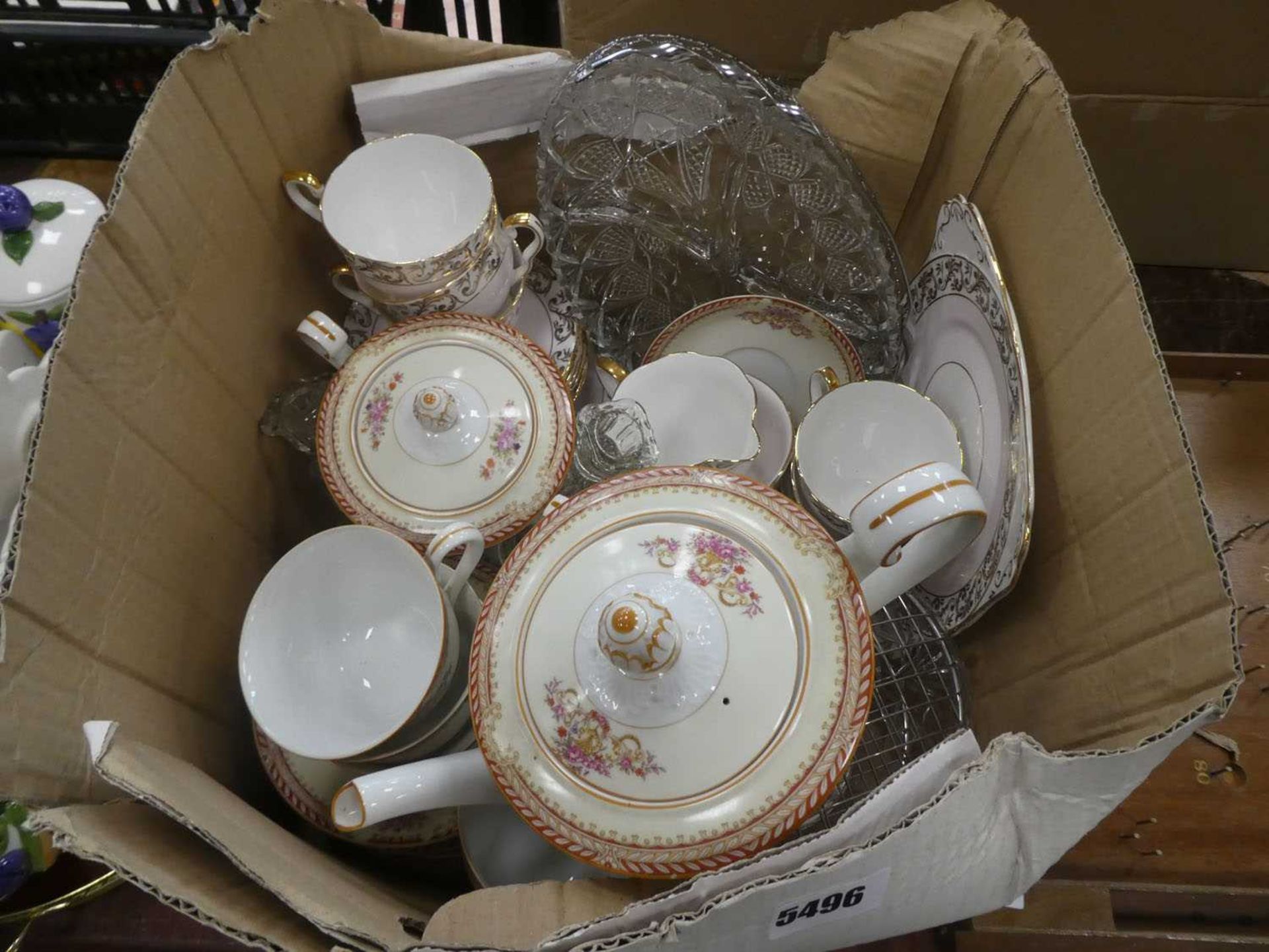 Box containing of Royal Stafford and Noritake crockery plus glass candlestick, bowl and dish