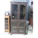 Glazed 4 door display cabinet in two sections