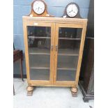 Glazed oak double door bookcase