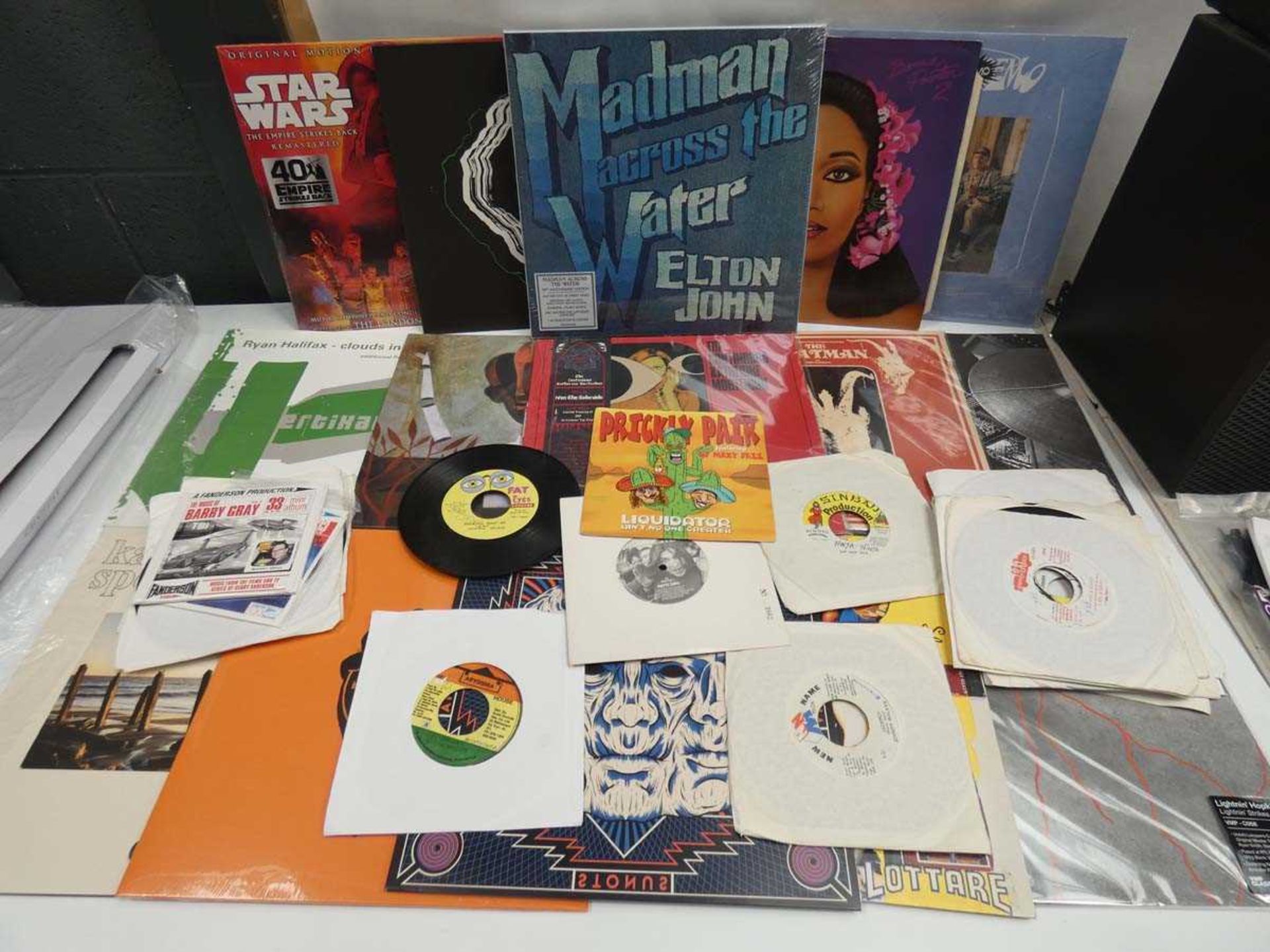 +VAT Box containing LP and 45 vinyl records to include Elton John, Ivan the Tolerable and others