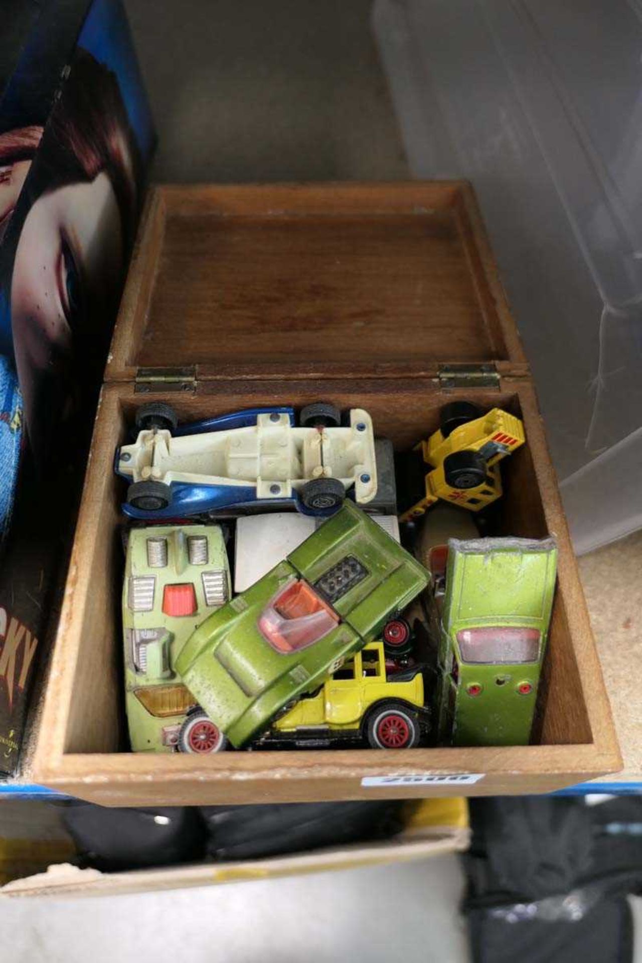 Wooden case containing various vintage diecast vehicles including various dinky cars