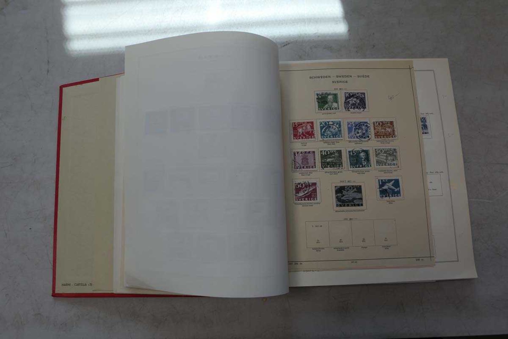 Collection of mainly European countries stamp set in red binder