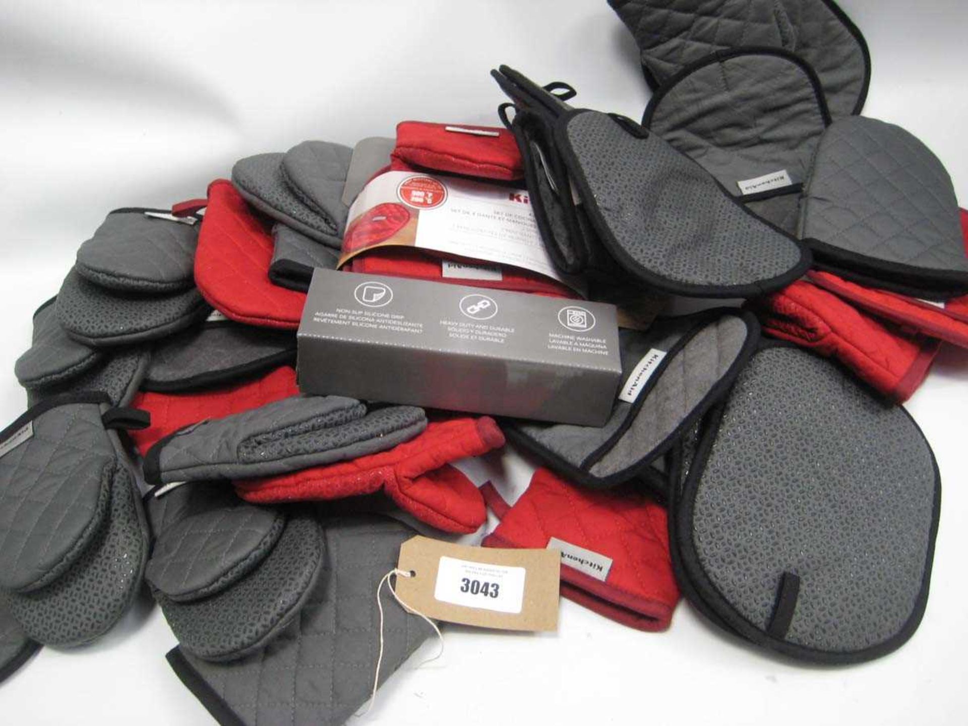 +VAT A bag containing KitchenAid Oven Gloves in Grey & Red.