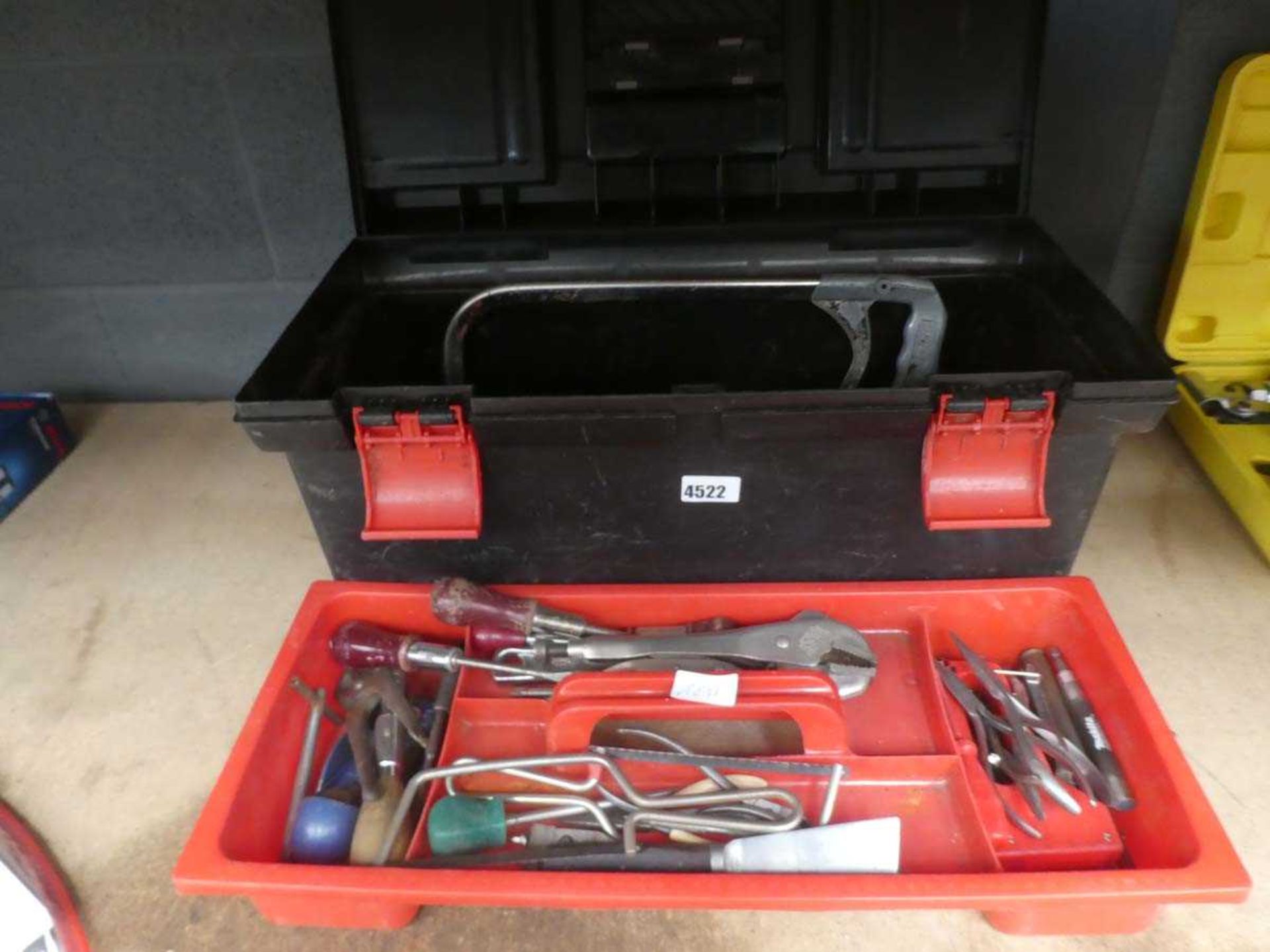 Toolbox containing various tools to include hacksaw, screwdrivers, stilsons, spanners, pliers, spray