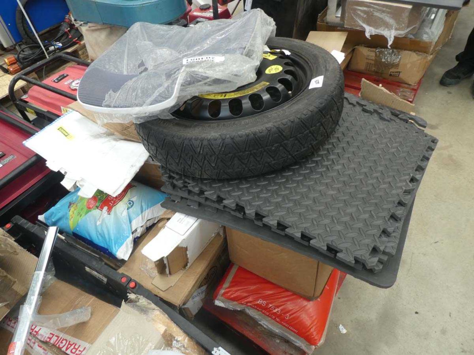 +VAT Pallet containing steel wheel and tyre, click together matting, small batteries, chair parts,