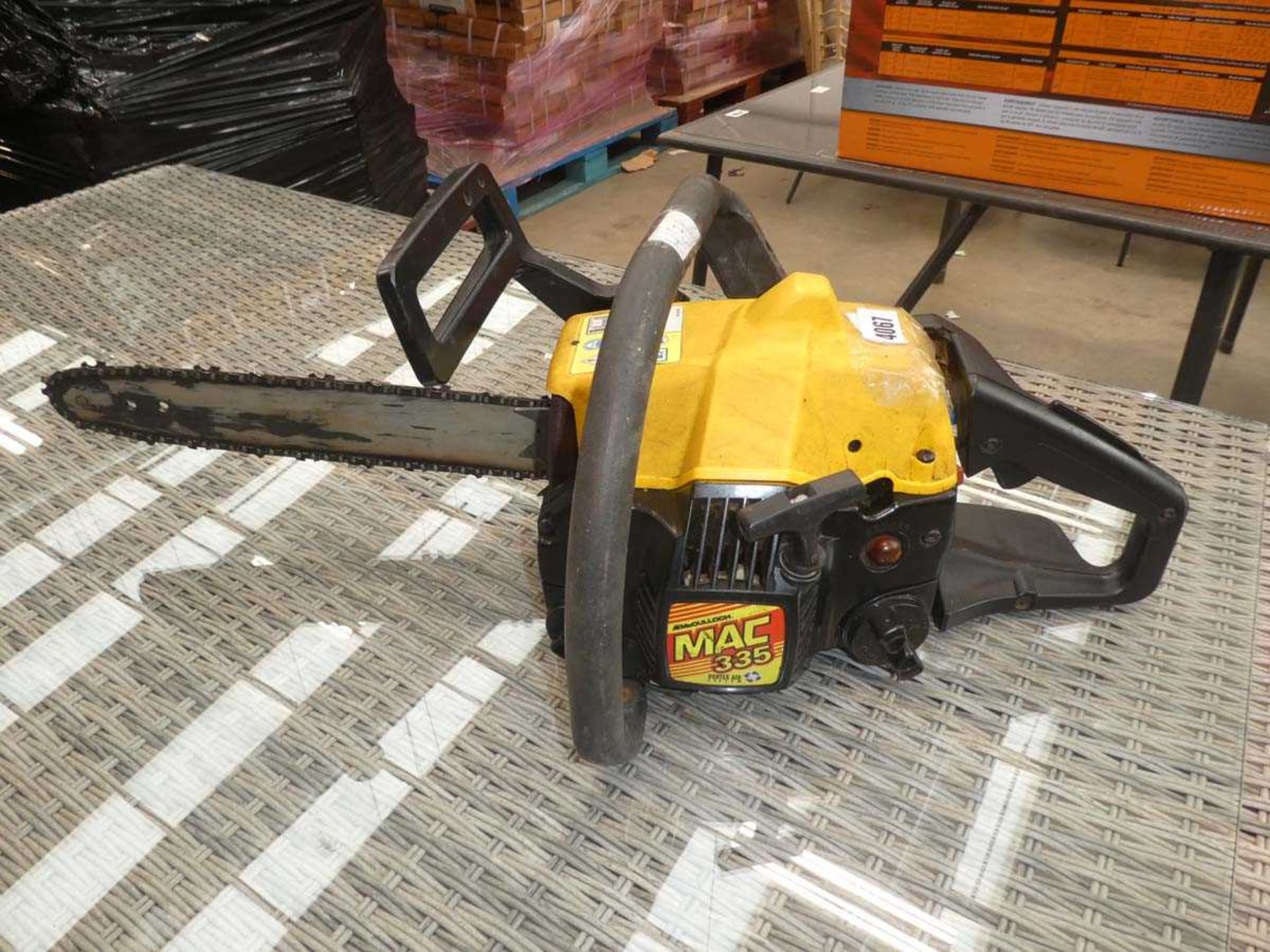 McCullough yellow petrol powered chainsaw