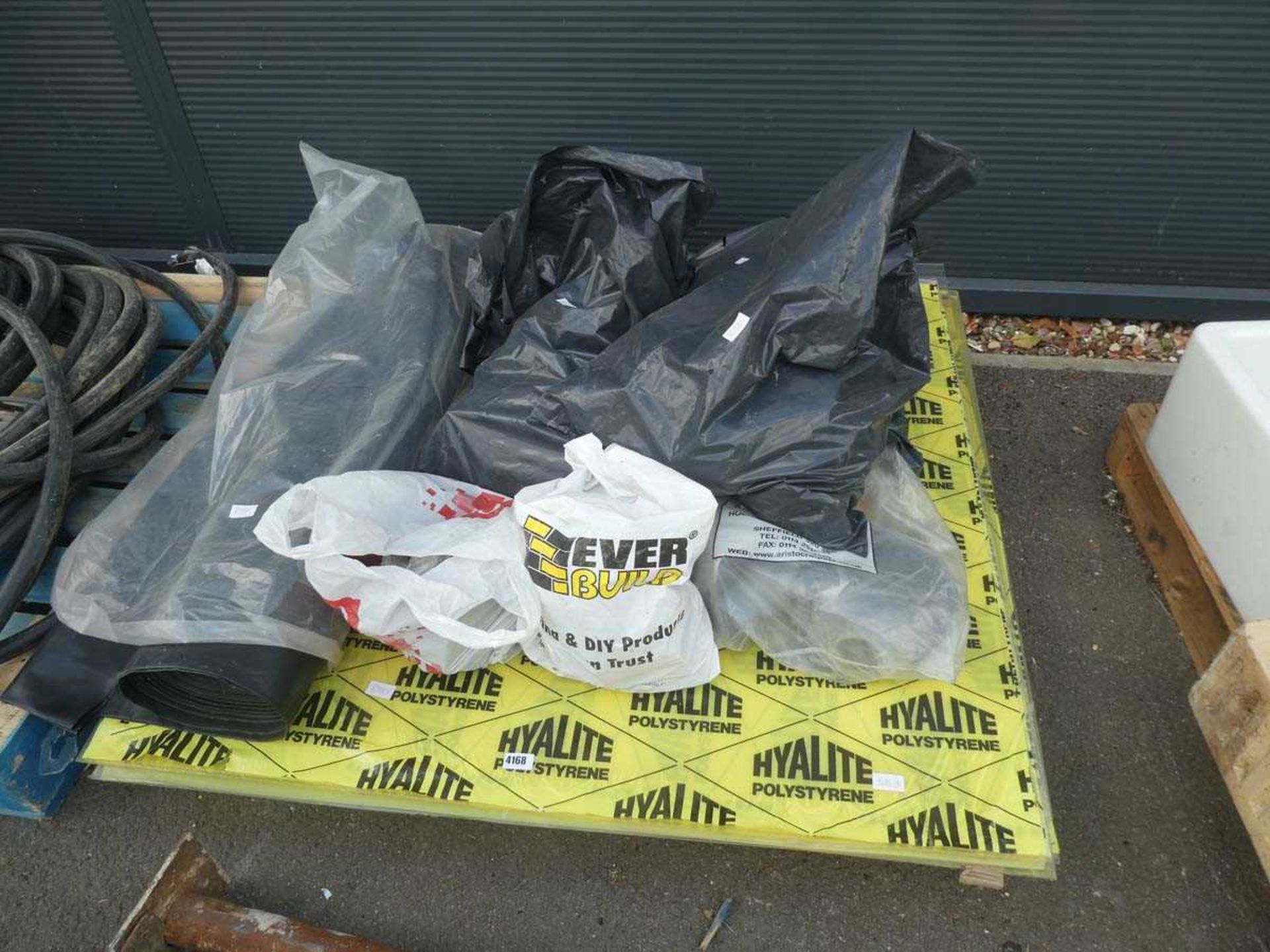 Pallet containing damp-proof membrane, gutter brackets, plastic sheeting and two accro props - Image 2 of 2