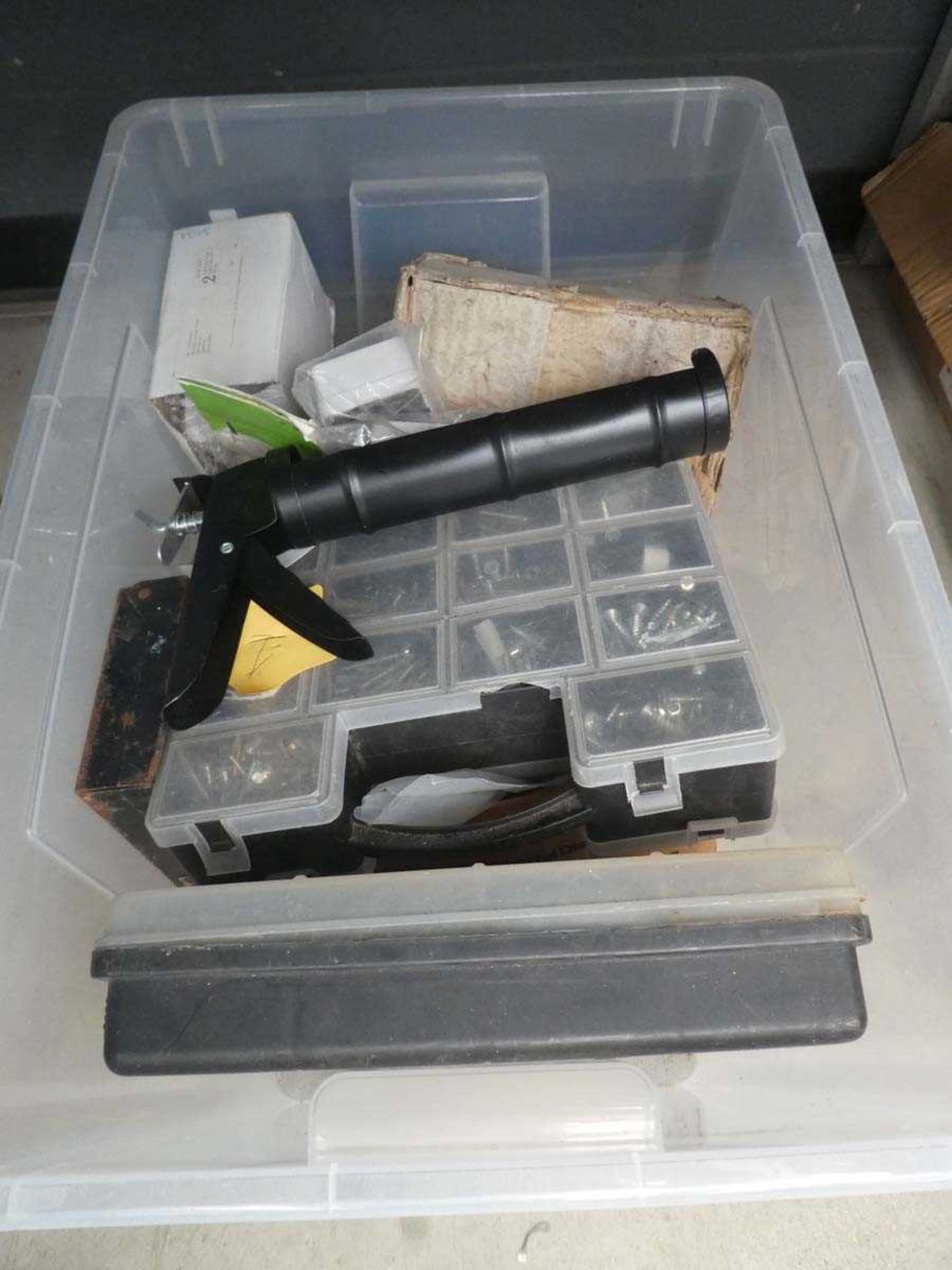 Box containing screws, fixings, silicon gun, etc
