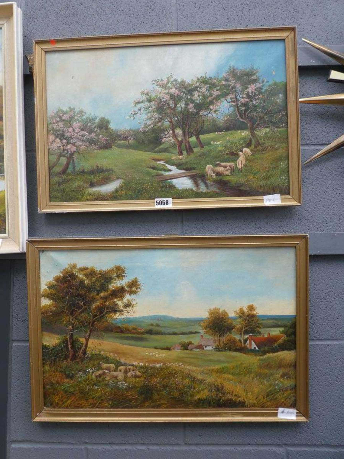 Pair of R R Hammond oils on canvas of rural landscapes with sheep