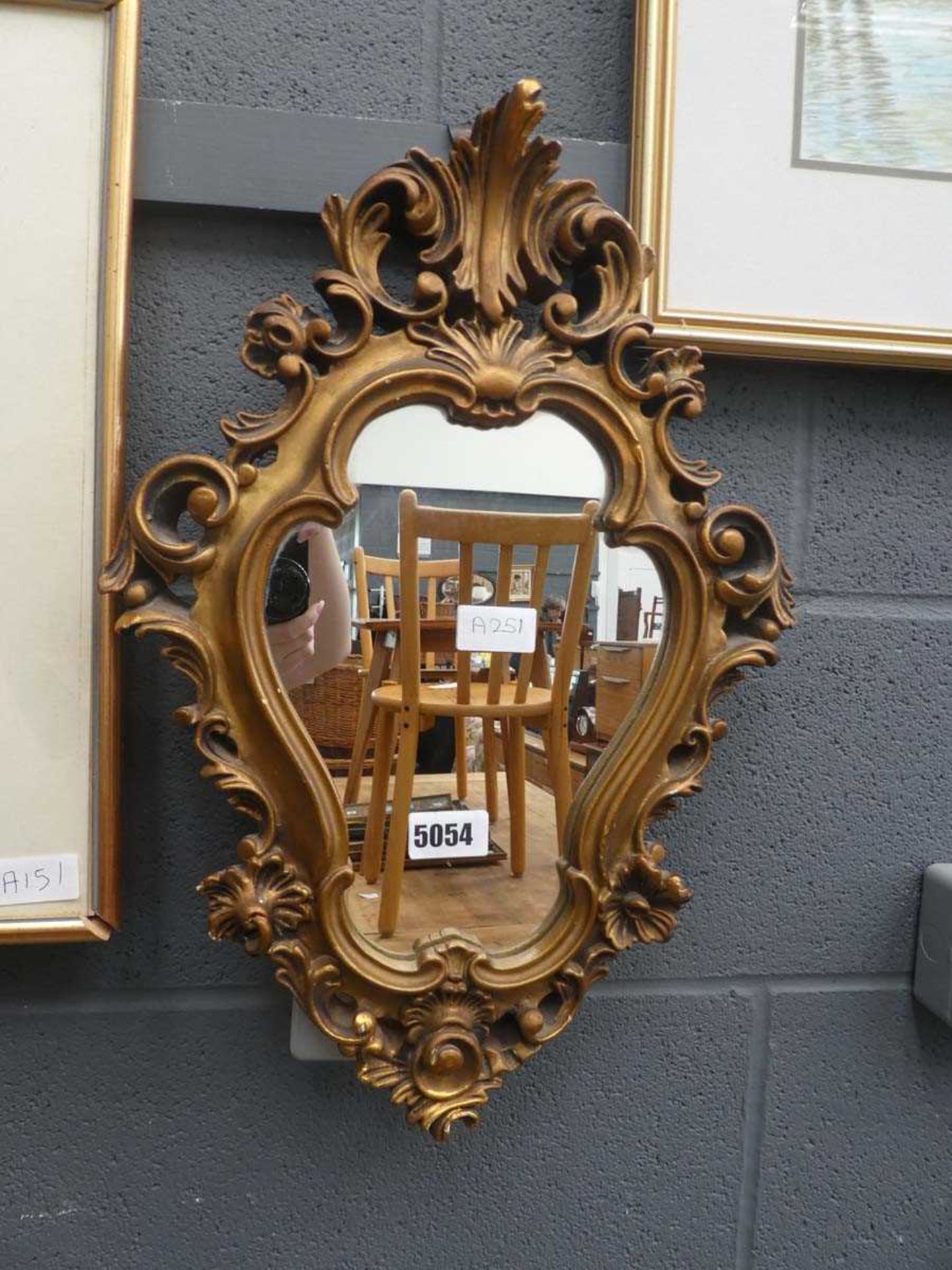 Mirror in decorative gilt frame