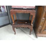 Pair of heavily carved Indian style side tables