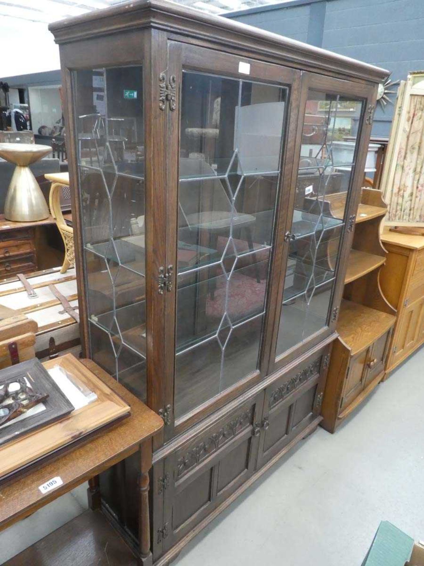 Dark oak and glazed double door china cabinet with cupboard under