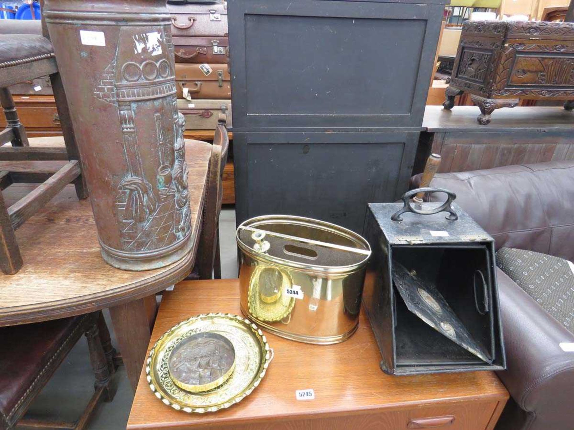 Magazine rack, trivet, brass ornaments, copper stick stand, a coal scuttle plus two brass trays