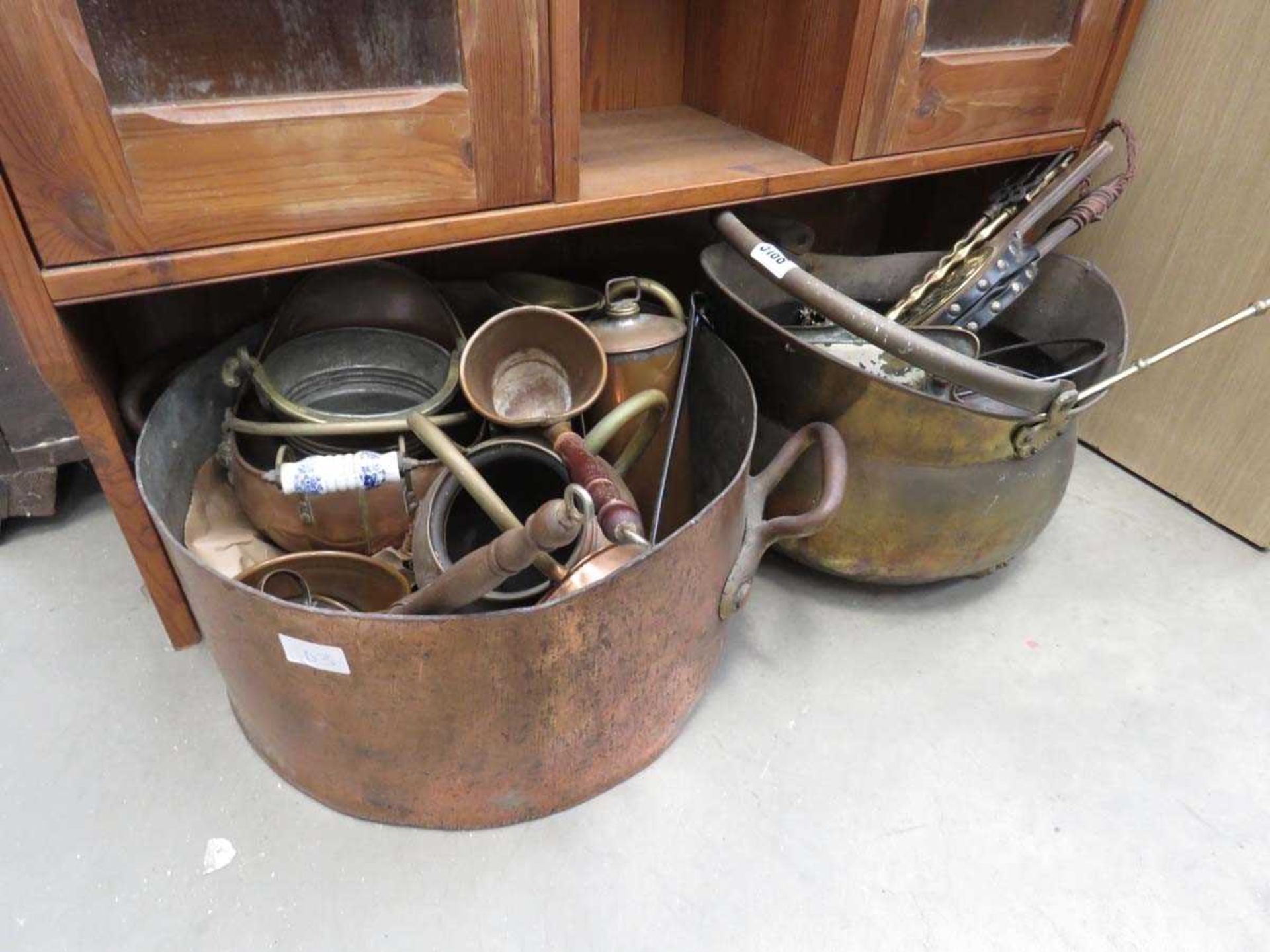 Large copper cooking pot, a coal scuttle, quantity of copper vessels, and a companion set