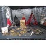 Cage containing fans, horse brasses, ornaments, quartz clocks and franking machine