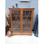 An Edwardian glazed double door bookcase