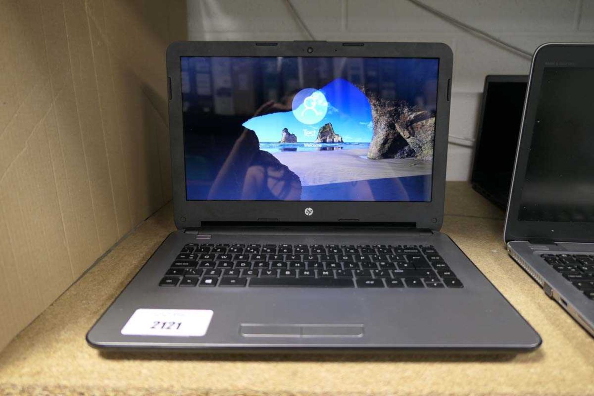 +VAT HP laptop with AMD processor, 4gb RAM, 1tb storage, running Windows 10, no power supply