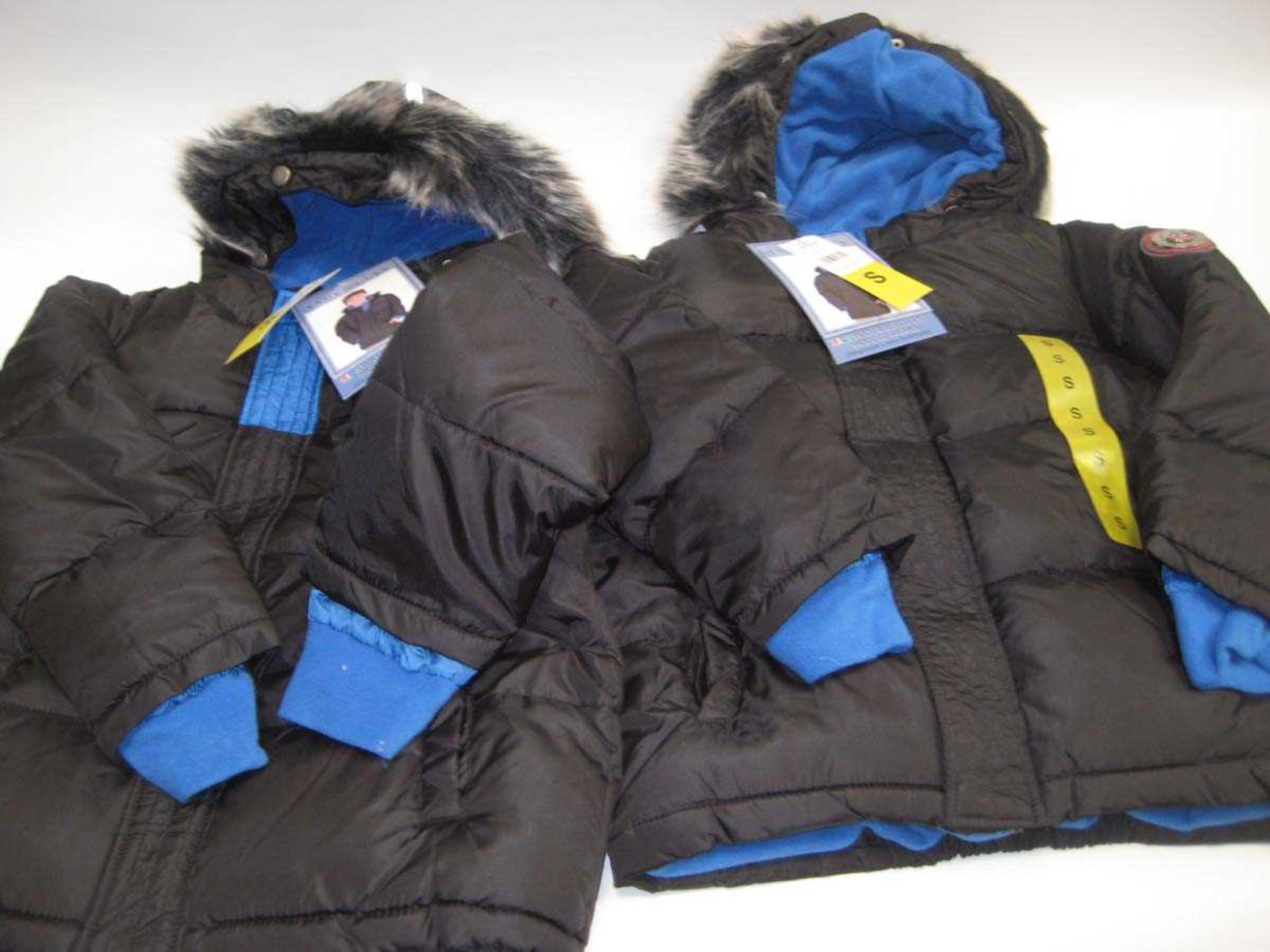 A bag containing 2x Boys Black Parka Coats in Small.