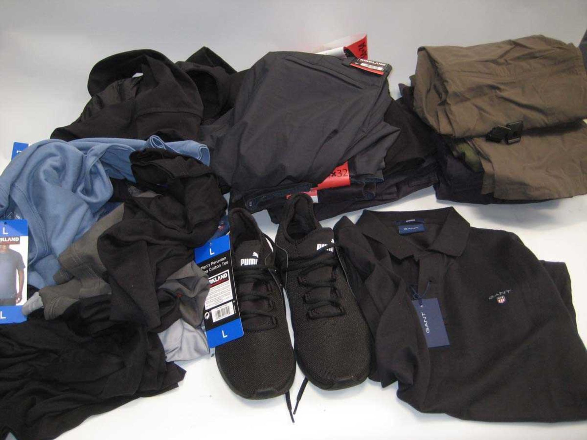 +VAT A bag containing Men's Clothing in various sizes, including Puma Trainers & Gant Polo T Shirt.