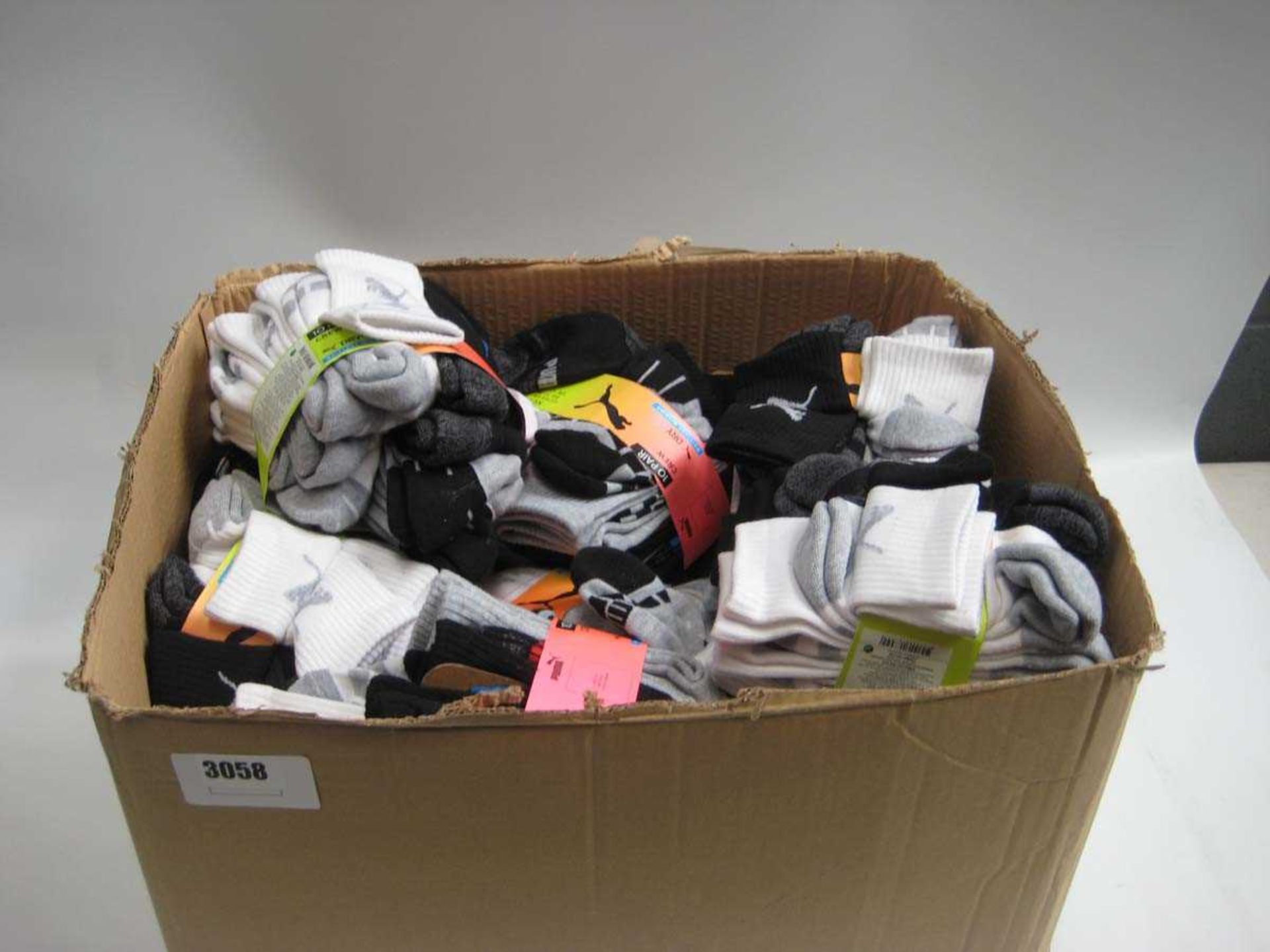 A box containing Kids & Youth Puma Socks in various sizes.