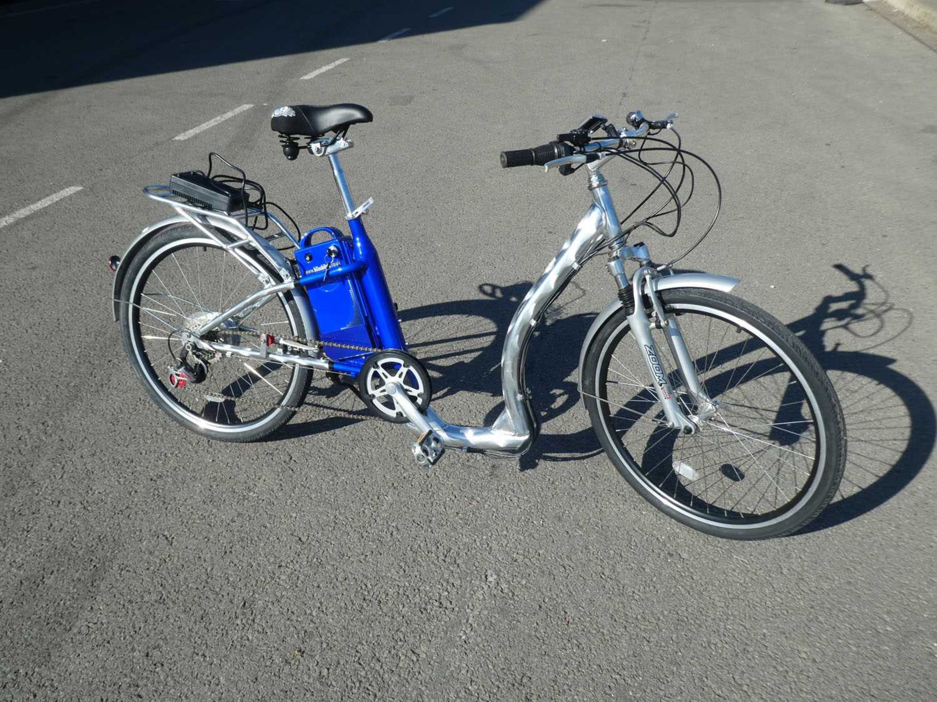 Silver and blue electric bike with GN charger