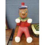 Carved and painted wooden figure of a clown