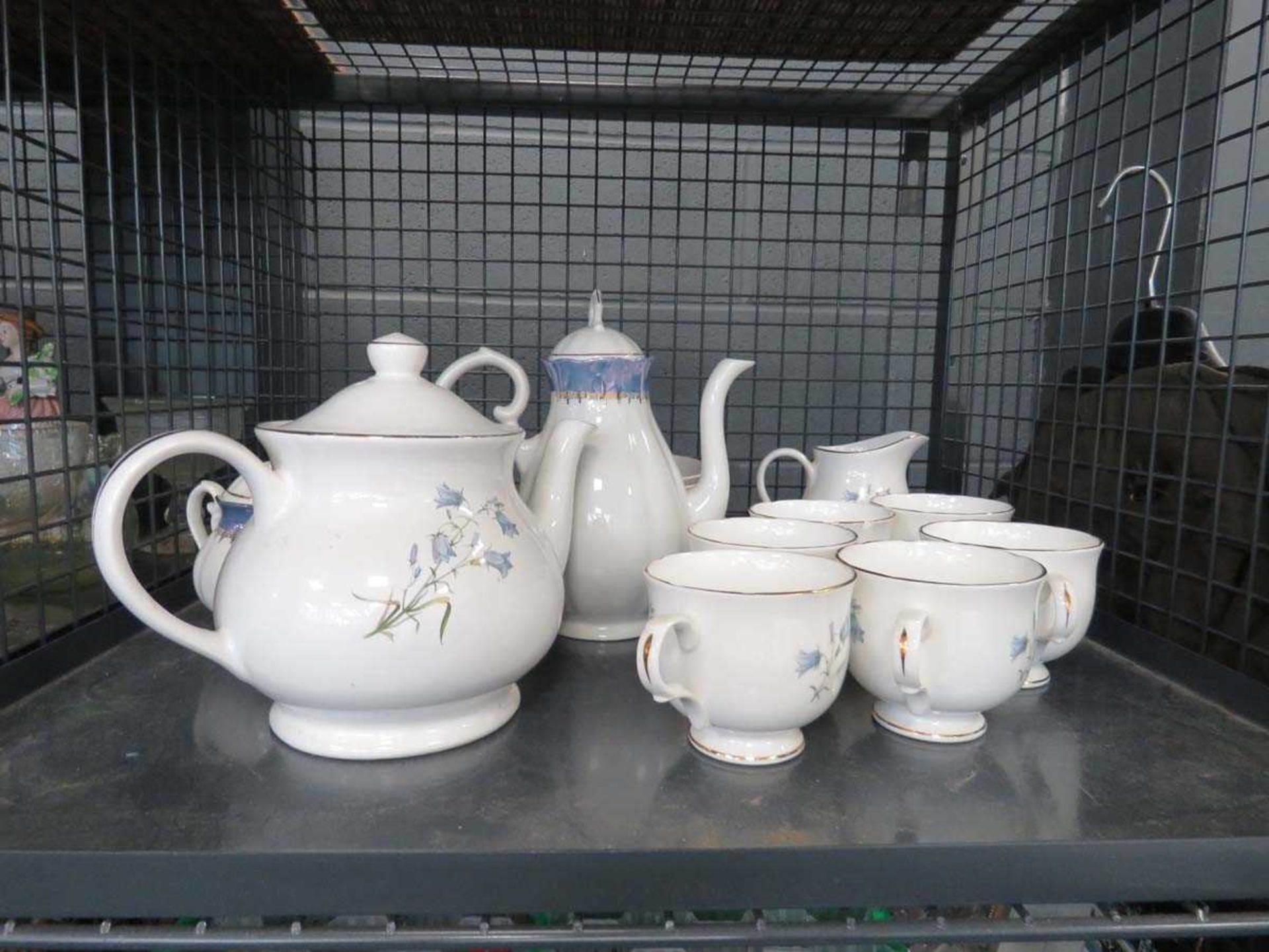 Cage containing a Sadler wellington patterned tea service