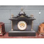 Slate mantle clock with columns to the side