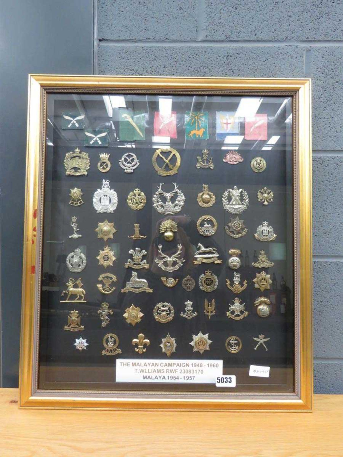 Wall plaque with cap badges