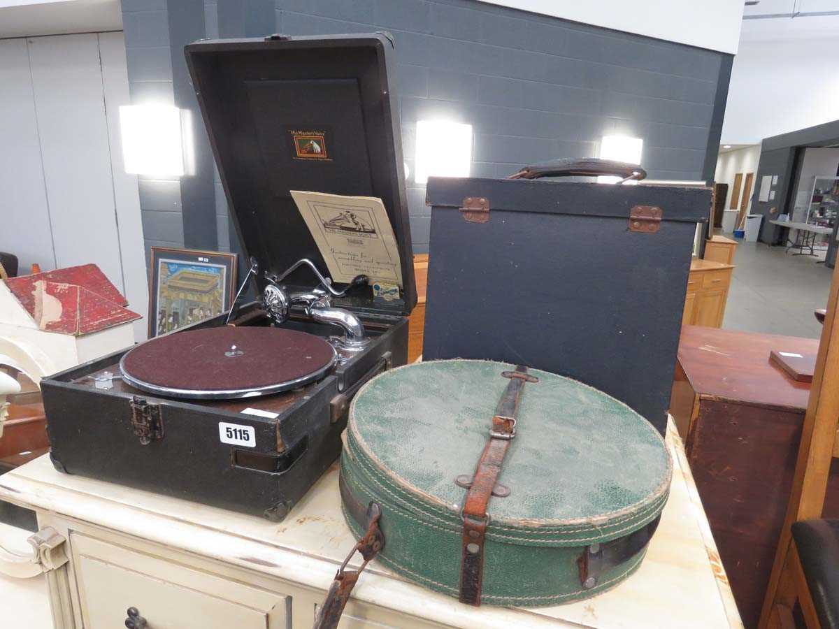 Vintage HMV portable gramophone, model number 102. Includes HMV record box containing various 78's