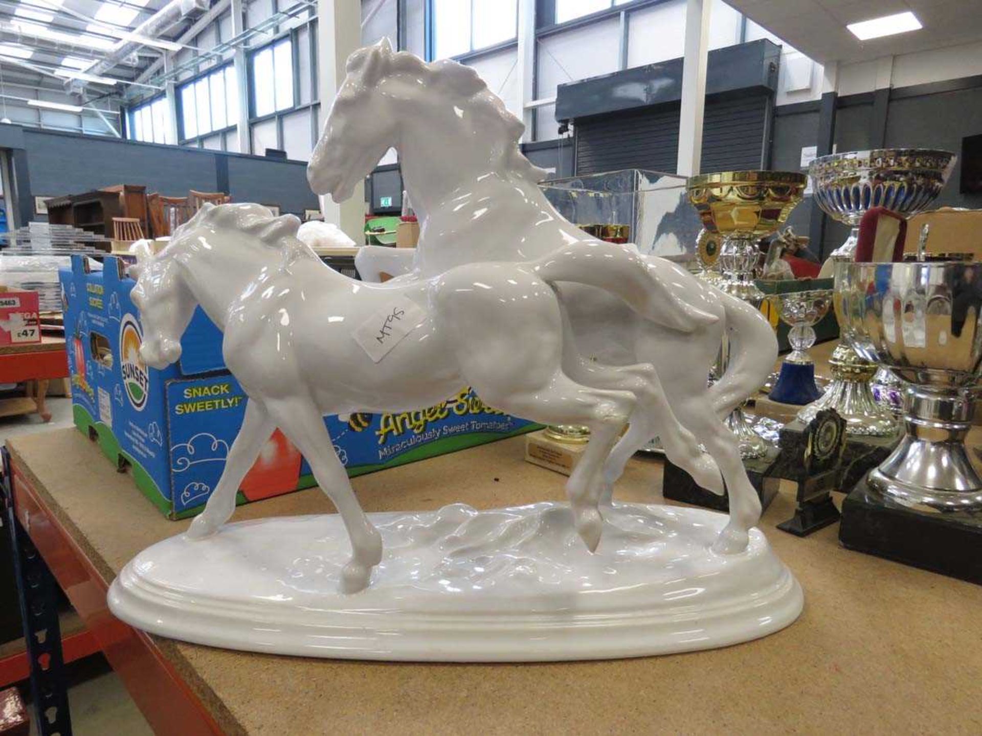 Pottery figure of 2 running horses