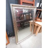 Rectangular bevelled mirror in silver painted frame