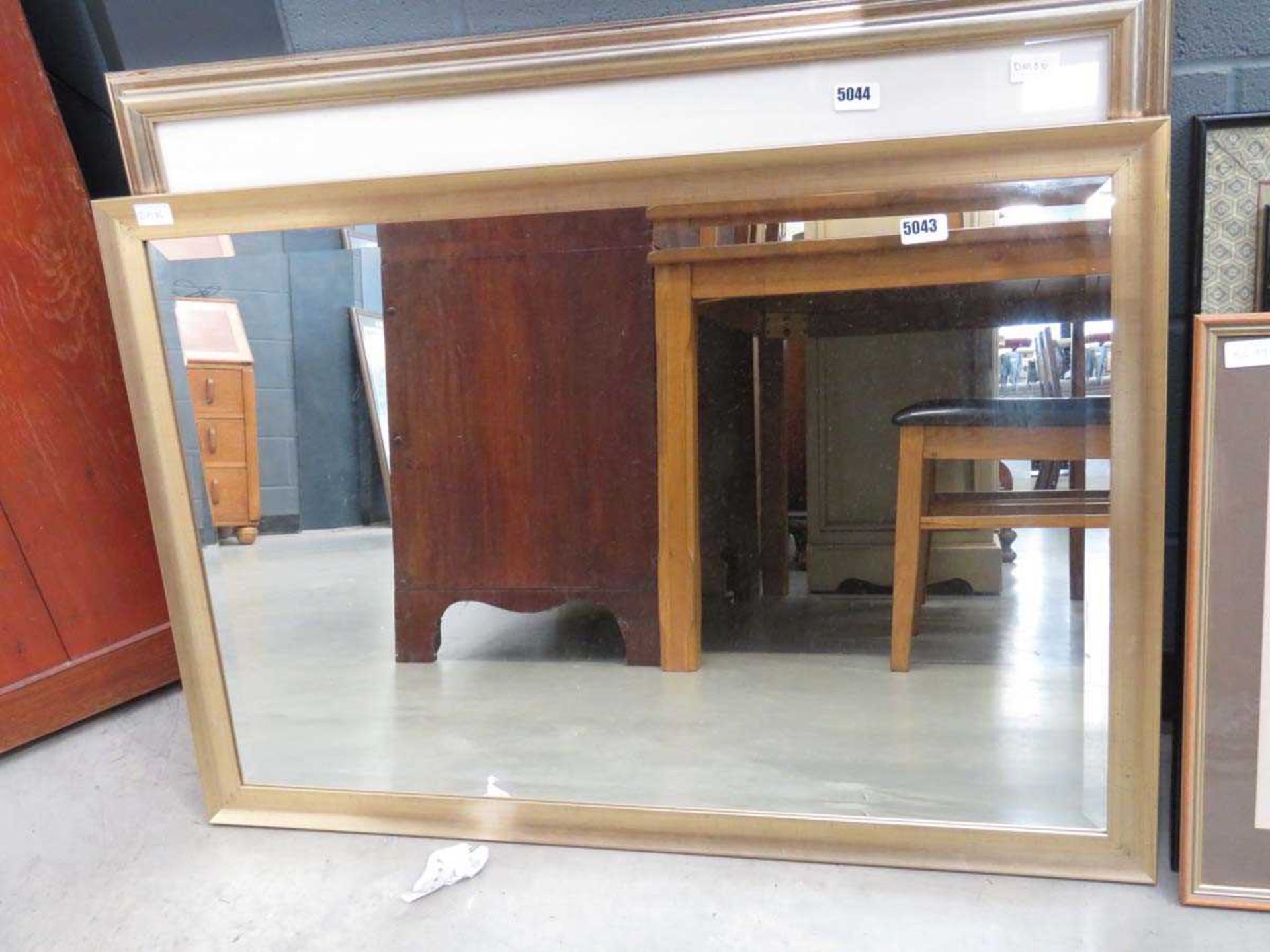 Rectangular bevelled mirror in gilt frame