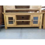 Small oak entertainment unit with glazed doors to the side